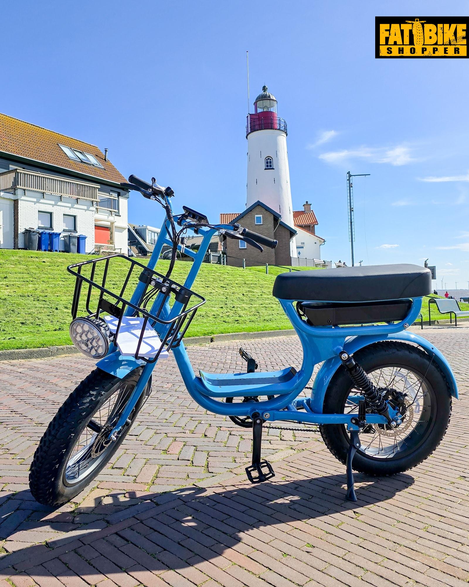 electric green bike bicycle on a beautiful bright day Netherlands Urk, blue electric fatbike